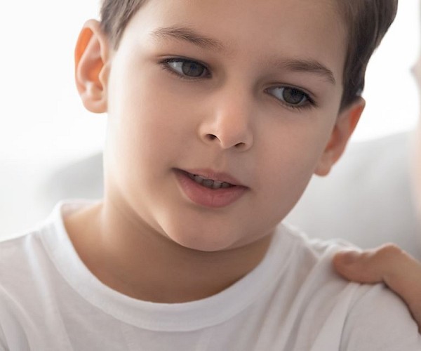 Close up of solemn looking boy