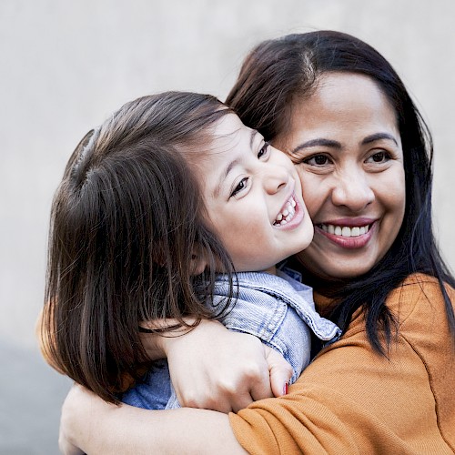 Ethnic minority woamn and child embracing