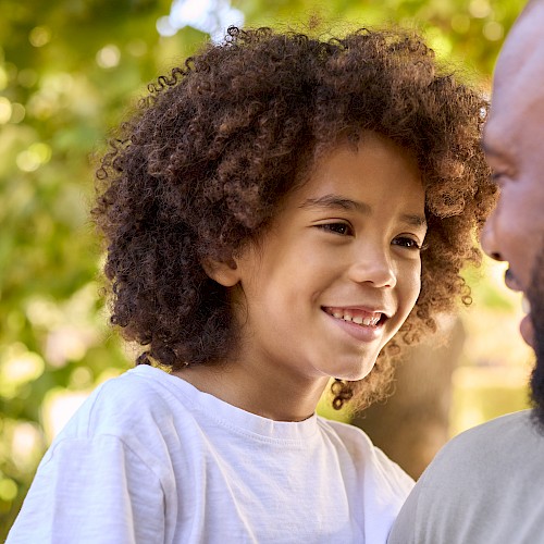 BAME older child smiling