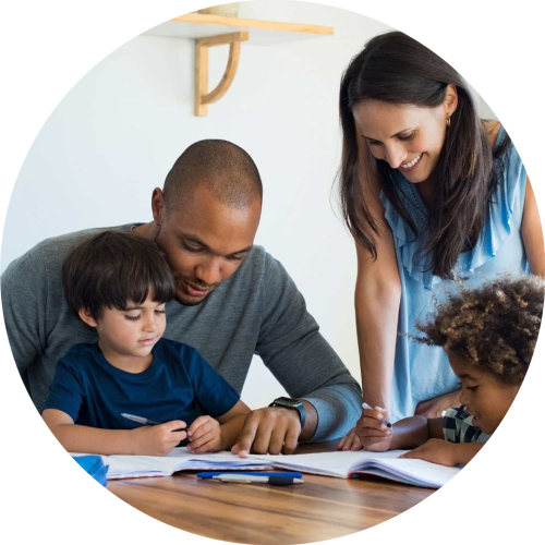 Adoptive parents helping children with homework